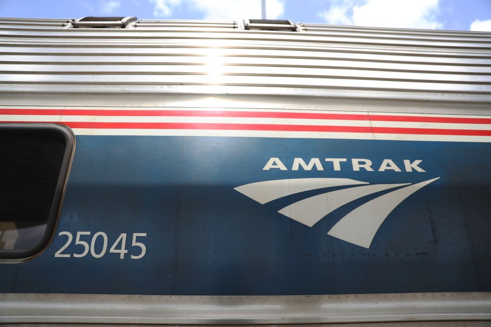 Image: An Amtrak train waits at a station