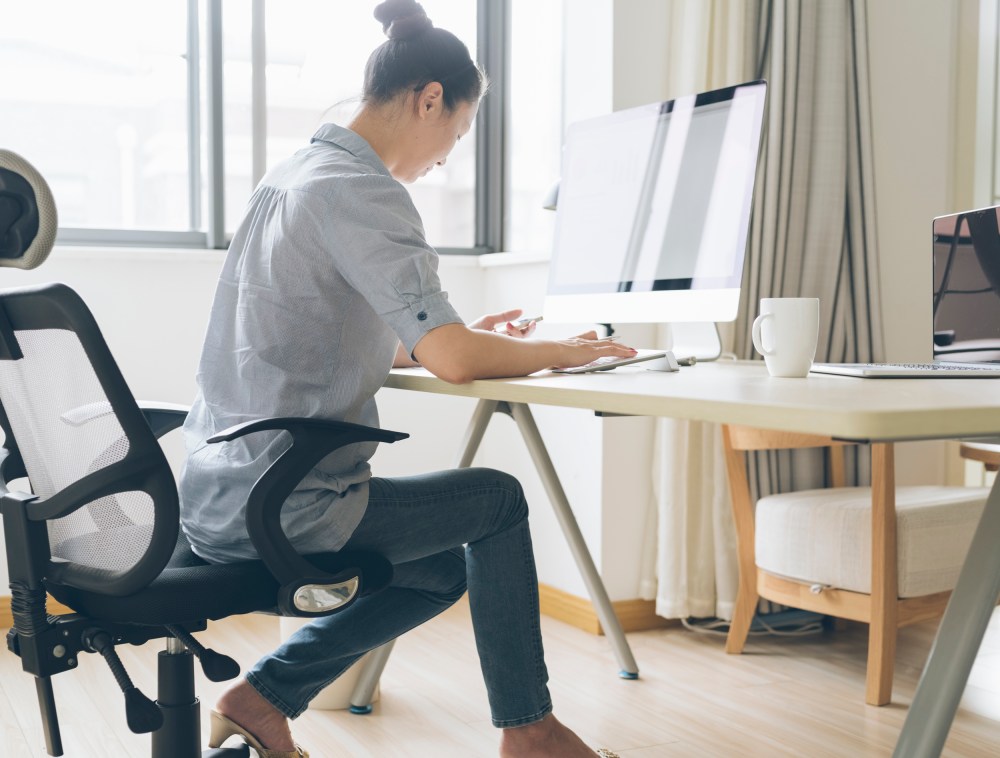 Image: A woman works from home
