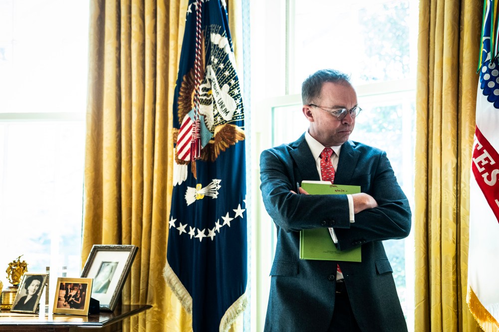 Image: Acting White House Chief of Staff Mick Mulvaney listens in the Oval Office on March 19, 2019.