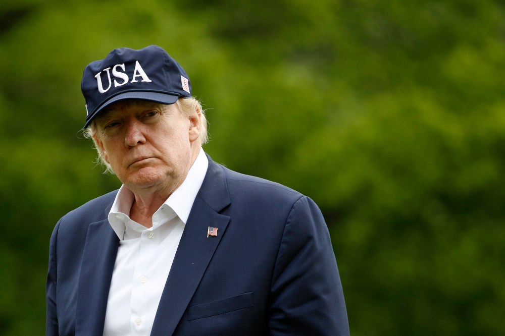 Image: President Donald Trump walks on the South Lawn of the White House after stepping off Marine One