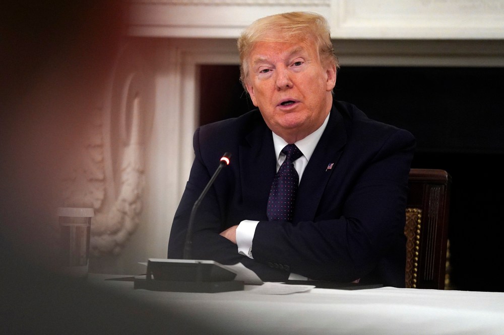 Image: President Donald Trump listens during a meeting with restaurant industry executives about the coronavirus response, in the State Dining Room of the White House