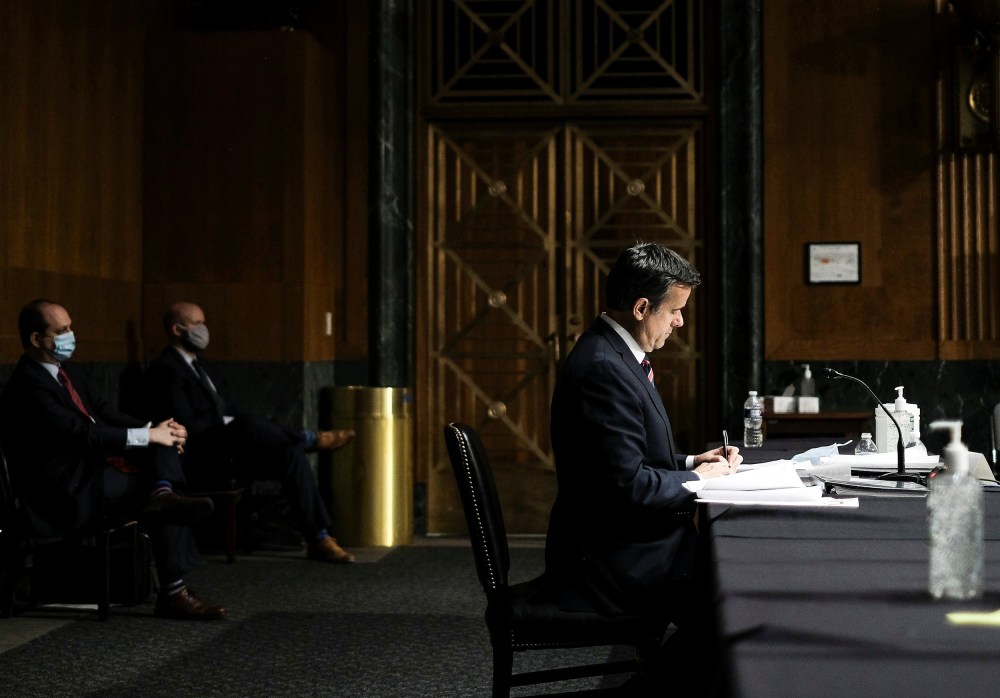 Image: U.S. Rep. John Ratcliffe finishes testifying before a Senate Intelligence Committee nomination hearing on Capitol Hill in Washington