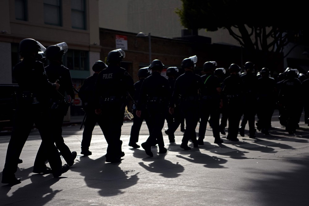Image: police riot gear march line