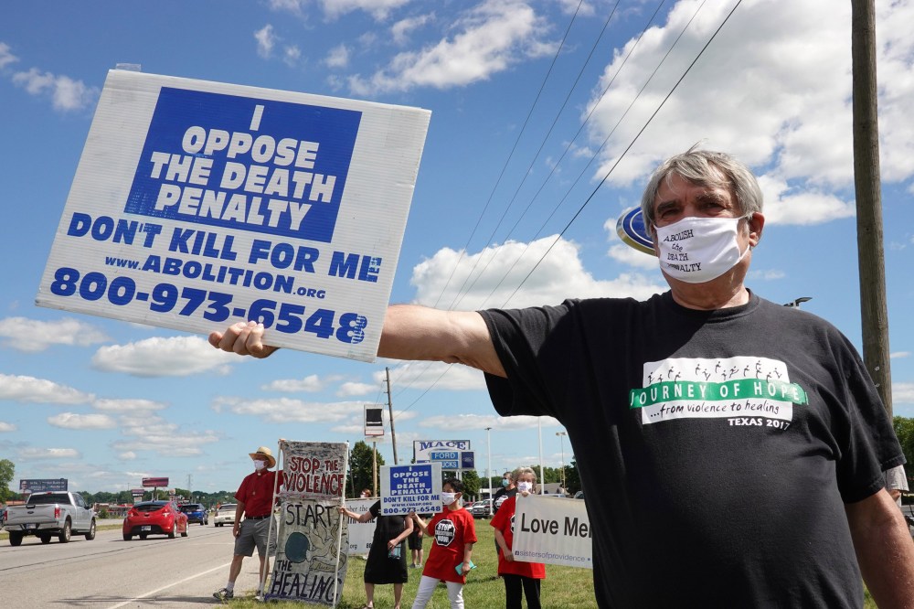 Image: Bill Pelke of Anchorage, Alaska expresses his opposition to the death penalty during a protest near the Federal Correctional Complex where Daniel Lewis Lee is scheduled to be executed