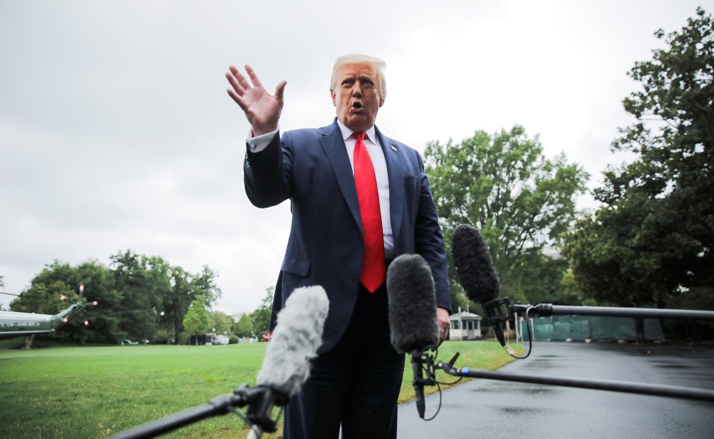 Image: U.S. President Trump speaks to reporters as he departs for a trip to Florida from the White House in Washington