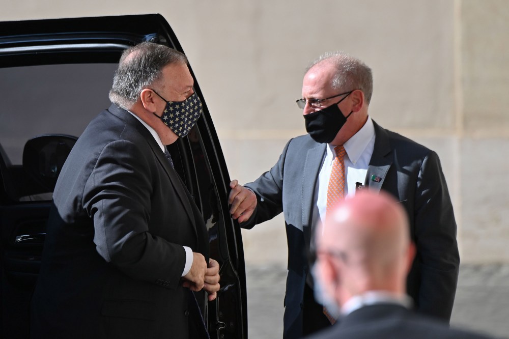 Image: Secretary of State Mike Pompeo gets out of his car as he arrives on Oct.1, 2020 at San Damaso courtyard in The Vatican