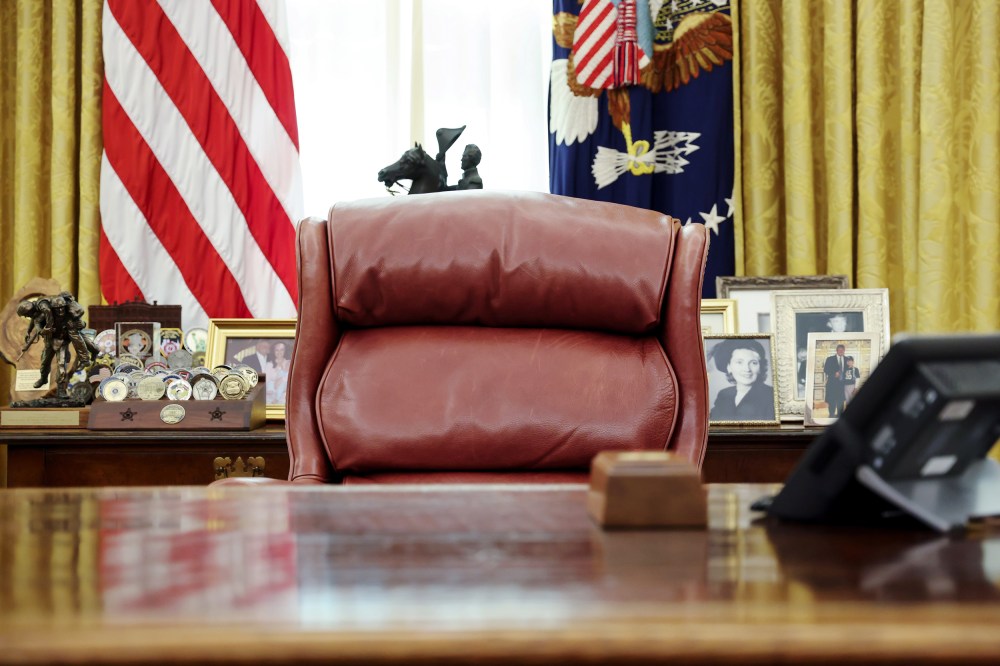 Image: President Trump's chair sits empty in the Oval Office at the White House in Washington
