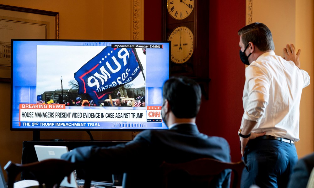 Image: House impeachment managers watch the first day of proceedings in the Senate trial of former President Donald Trump from a room in the Capitol in Washington