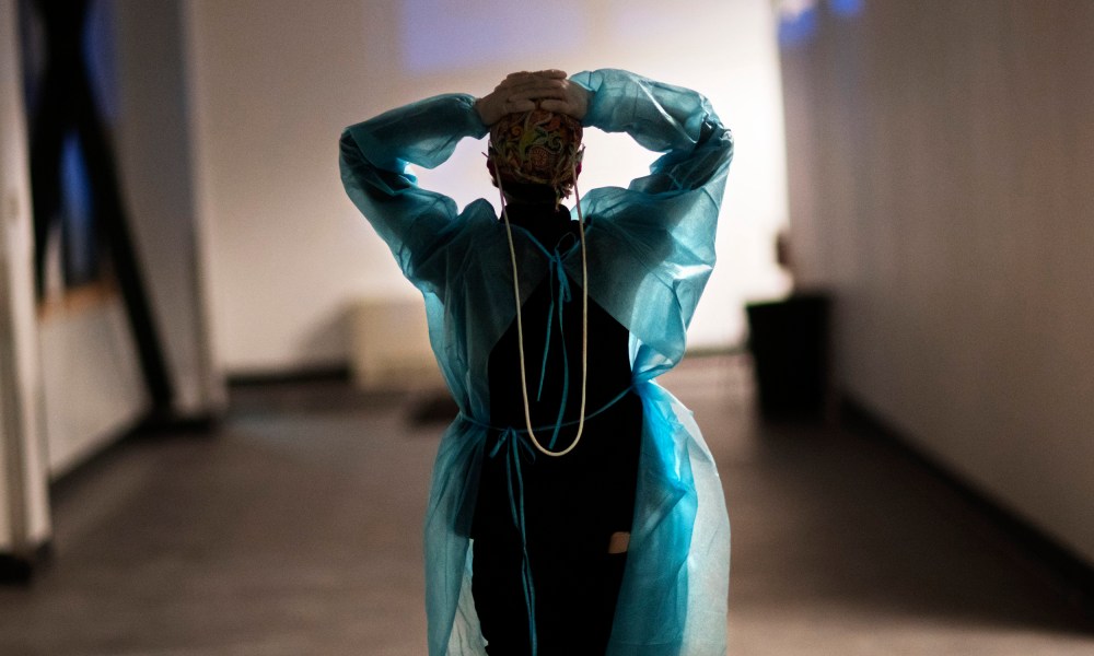 Image: A nurse walks down the hallway of a hospital