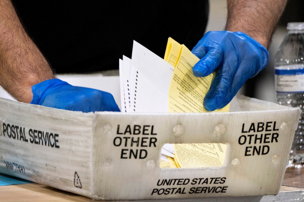 Fulton County Georgia elections workers process absentee ballots for the Senate runoff election in Atlanta on Jan. 5, 2021.