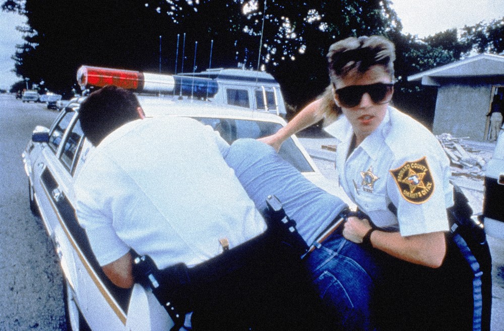 Image: Police officers in Broward County, Fla., restrain a suspect in a 1989 episode of "COPS."