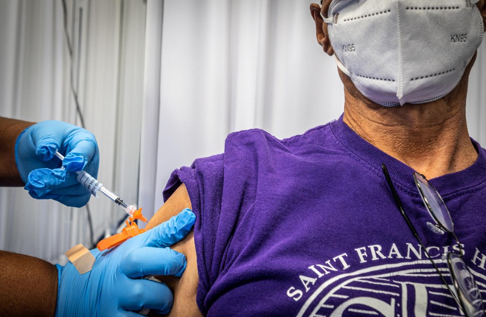 A man receives his third Covid-19 vaccine shot at Kennedy Memorial Park in Hempstead, N.Y., on Oct. 14, 2021.