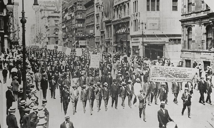 Image: Archival image of people marching at the 1917 Silent Parade in New York.