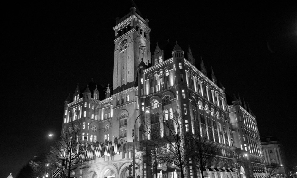 Image: View of the Trump International Hotel at night.