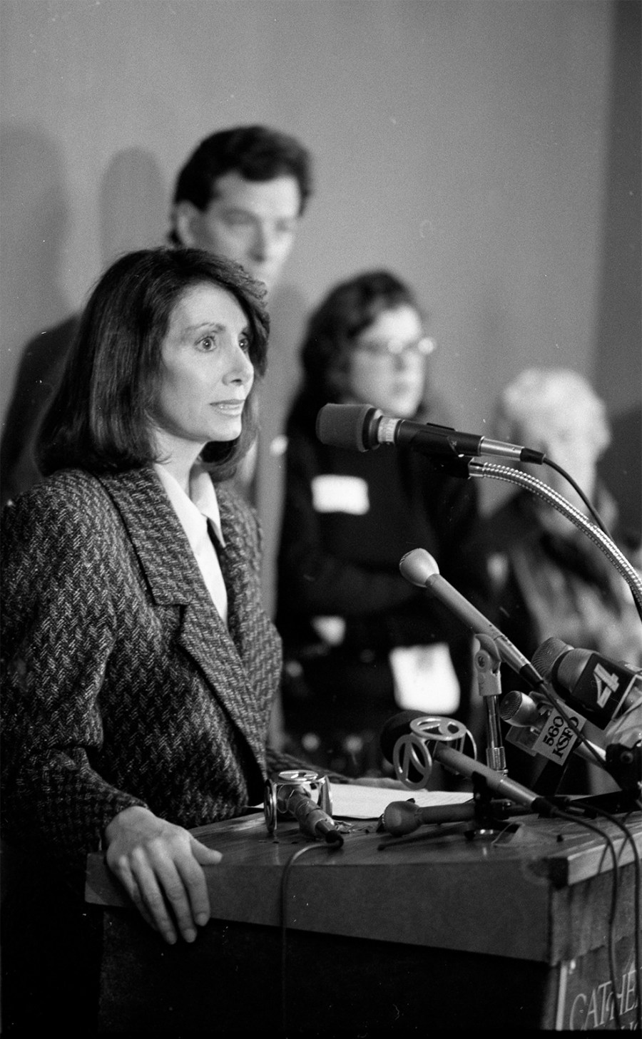 Archival image of Nancy Pelosi making an announcement.
