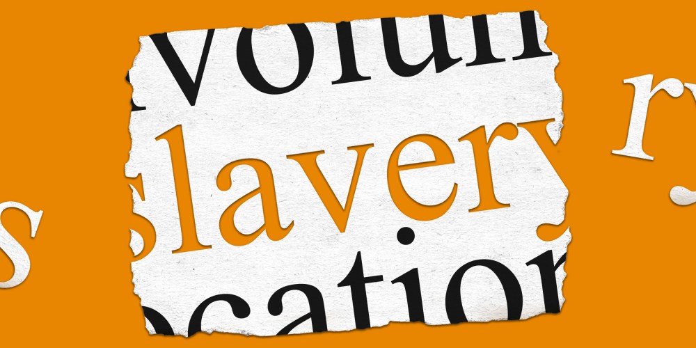 Photo illustration: A piece of paper with the word,"slavery" punched out.