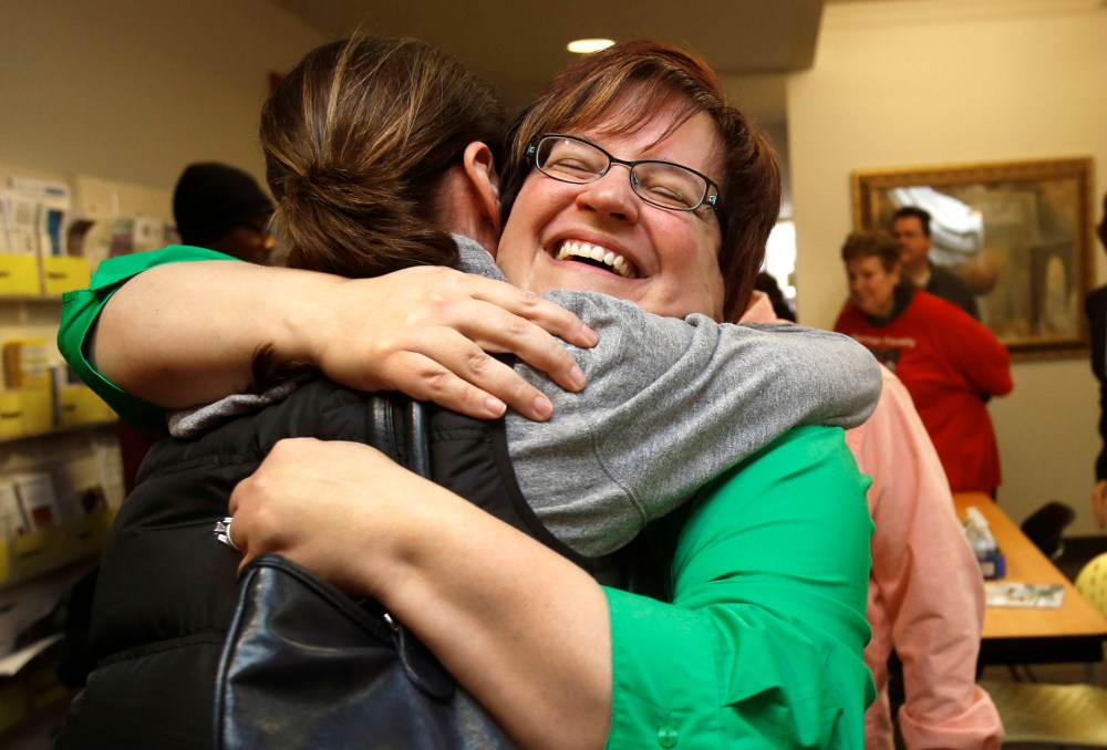 Plaintiff April Deboer celebrates after a Michigan federal judge ruled that a ban on same-sex marriage violates the U.S. Constitution and must be overturned, in Ferndale, Michigan March 21, 2014.