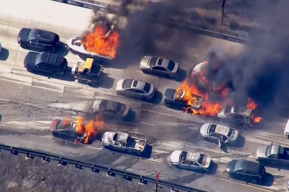 Cars are shown burning on the Interstate 15 freeway in the Cajon Pass, Calif. in the frame grab from KNBC video on July 17, 2015. (Photo by NBCLA.com/Reuters)