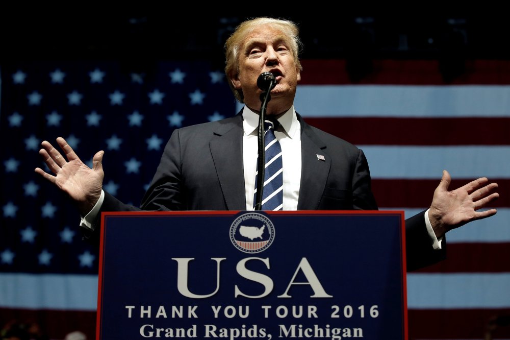 Image: U.S. President-elect Donald Trump speaks at a "Thank You USA" tour rally in Grand Rapids