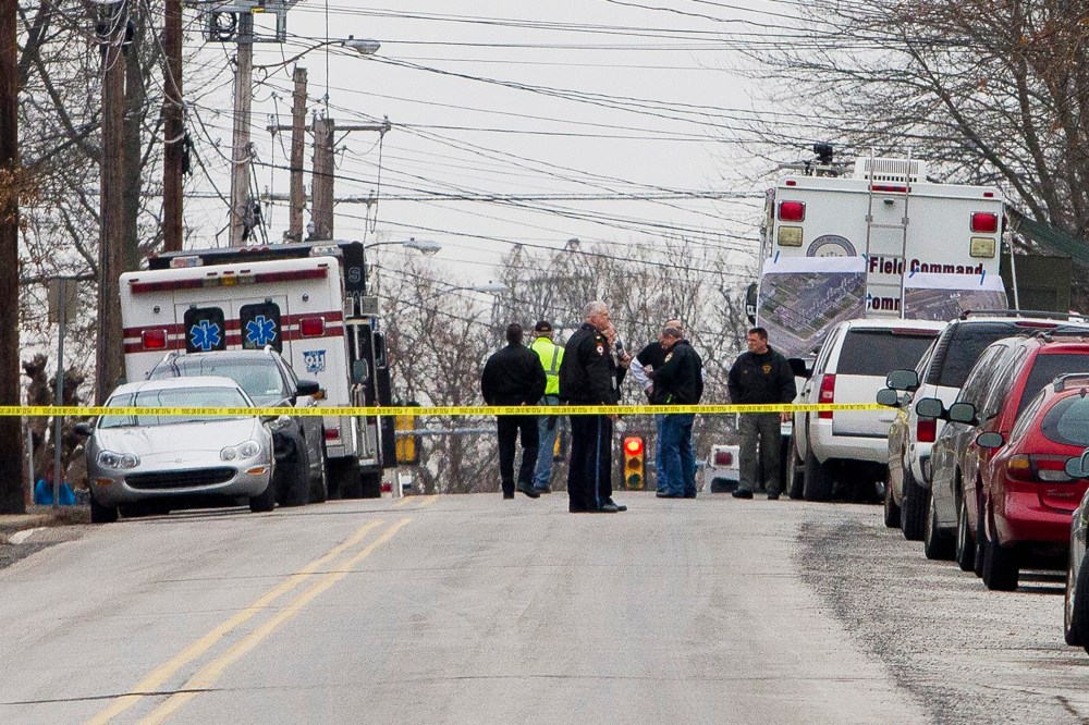 Police have the streets taped off as they search near a home in a suburb of Philadelphia where a suspect in five killings was believed to be barricaded in Souderton, Pa. on Dec. 15, 2014. (Brad Larrison/Reuters)