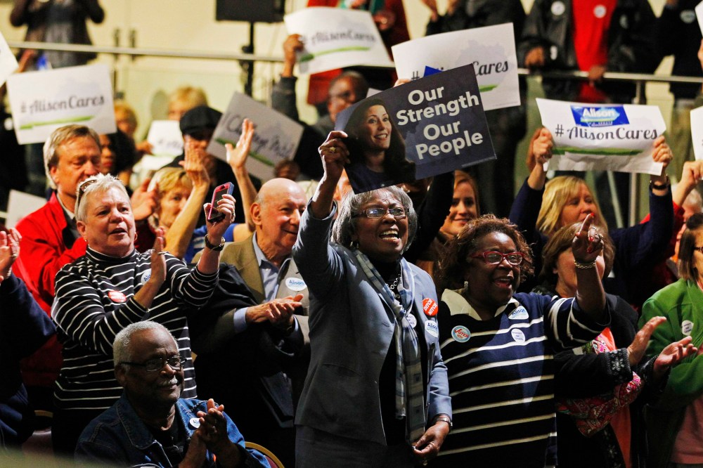 Campaign supporters cheer for Democratic Senate candidate Alison Lundergan Grimes during a campaign rally at the Kentucky Center for African American Heritage in Louisville, Ky. on Nov. 3, 2014.