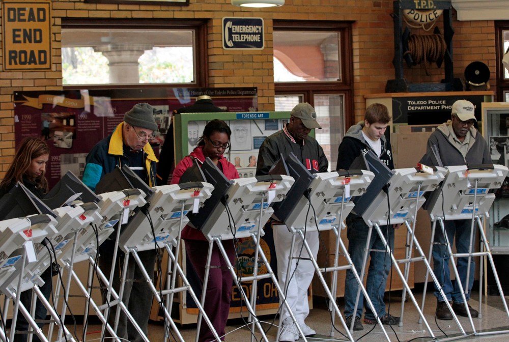 People vote at a polling site at the Toledo Police Museum for the 2012 presidential election in Toledo, Ohio, November 6, 2012.