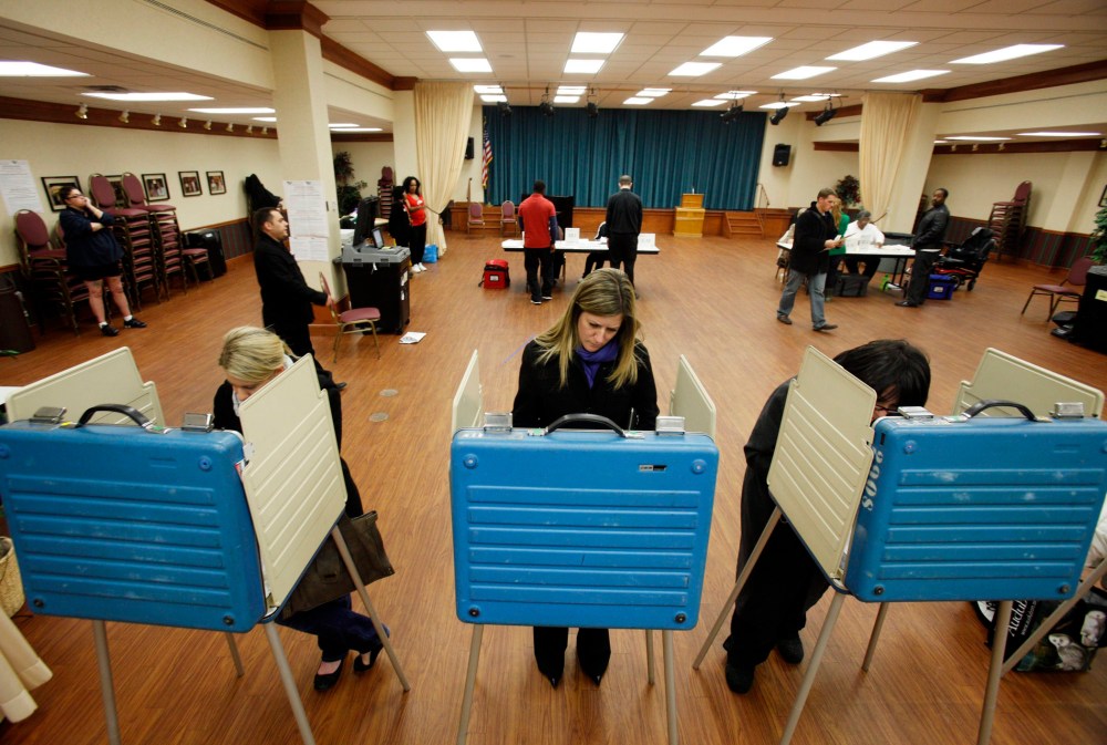 Voters cast their ballots at a polling site in the 2012 US presidential election in Cleveland, Ohio, November 6, 2012.