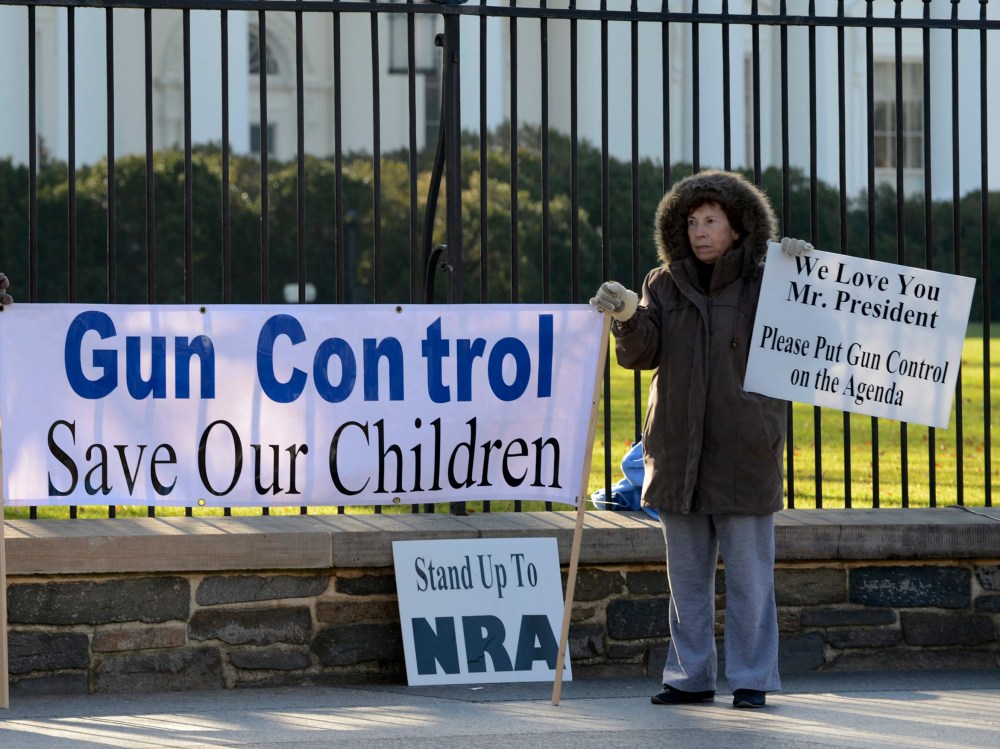 Supporters of gun control hold a sign that reads 'Gun Control Save Our Children', outside the White House in Washington DC, USA, 15 December 2012. Reports state on 14 December 2012 that a gun man unleashed a hail of gunfire that killed 20 children and...