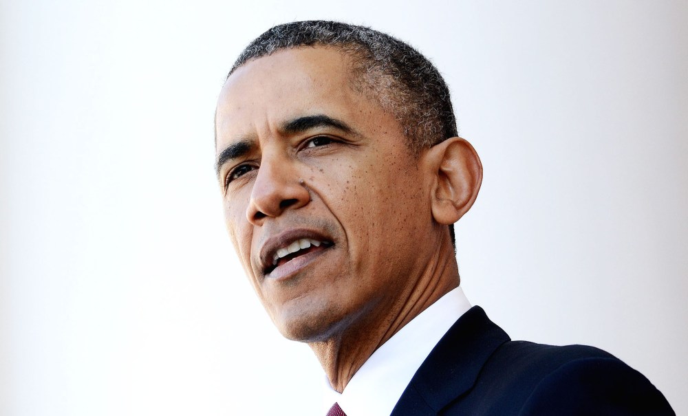 US President Barack Obama speaks during a ceremony to honor veterans at the Tomb of the Unknowns at Arlington National Cemetery, November 11, 2013.