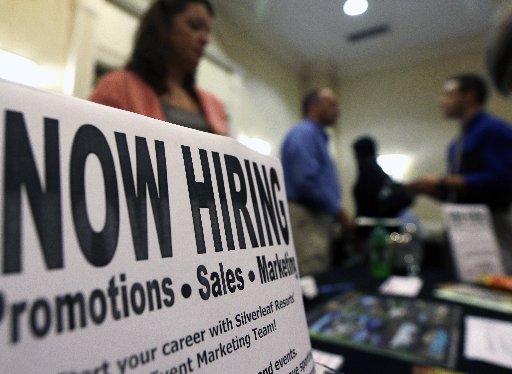 A sign attracts job-seekers during a job fair at the Marriott Hotel in Colonie, N.Y. The October employment report the government will release Friday, Nov. 2, 2012 will likely solidify the picture of the U.S. job market that’s emerged this year:...