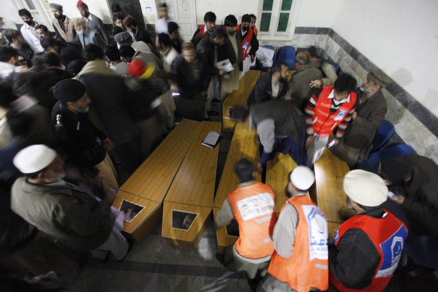 People move the bodies of a victims, of the gun attack on Bacha Khan University, at a hospital in Charsadda, Pakistan, Jan. 20, 2016. (Photo by Bilawal Arbab/EPA)