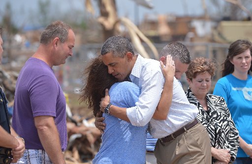 President Barack Obama is greeted as he tours a tornado affected area on May 26, 2013 in Moore, Oklahoma. (Photo by: Mandel/AFP Getty Images)