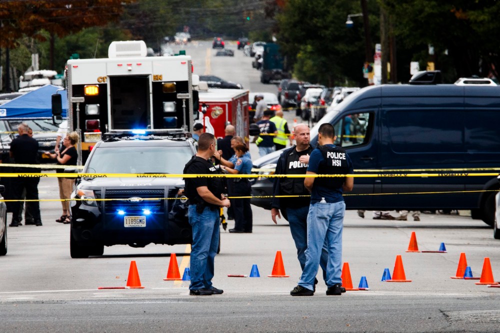 Police work at the scene where Ahmad Khan Rahami was arrested following a shootout with police, Sept. 19, 2016, in Linden, N.J. (Photo by Justin Lane/EPA)