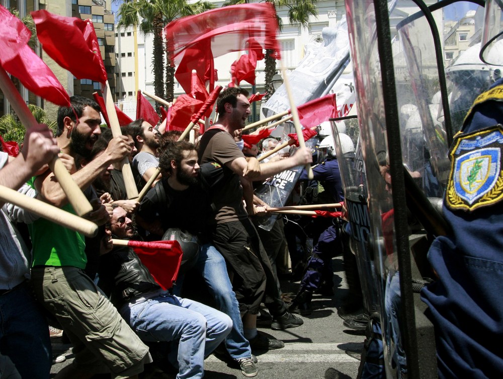 Protesters clash with policemen during riots at a May Day rally in Athens.