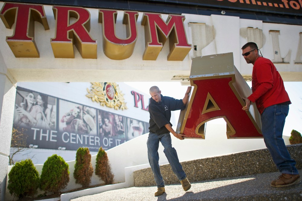 Nordaby and Demidio, of Calvi Electric, remove the letter 'A' from the signage of Trump Plaza Casino in Atlantic City, New Jersey