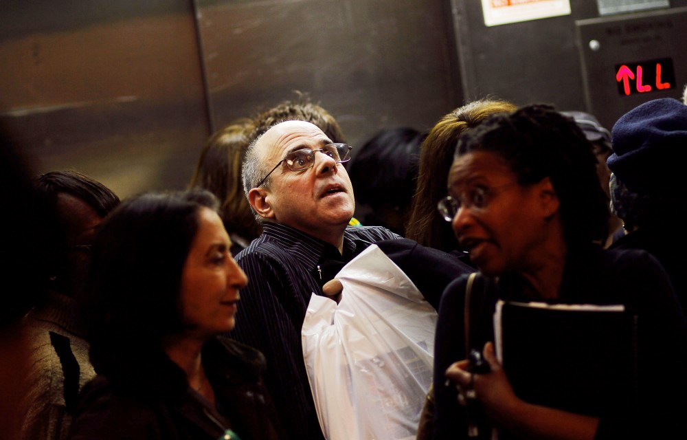 Older job-seekers crowd into an elevator on the way to a employment seminar at a "Work Search" event aimed at older unemployed people in New York City.