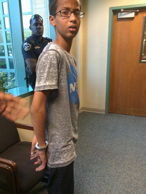 Ahmed Mohamed, A 14-year-old North Texas student, appears in handcuffs, after his arrest on charges of making a 