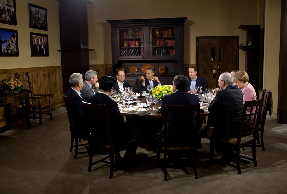In this handout provided by The White House, President Barack Obama hosts a working dinner in Laurel Cabin during the G8 Summit on May 18, 2012 at Camp David, Maryland.