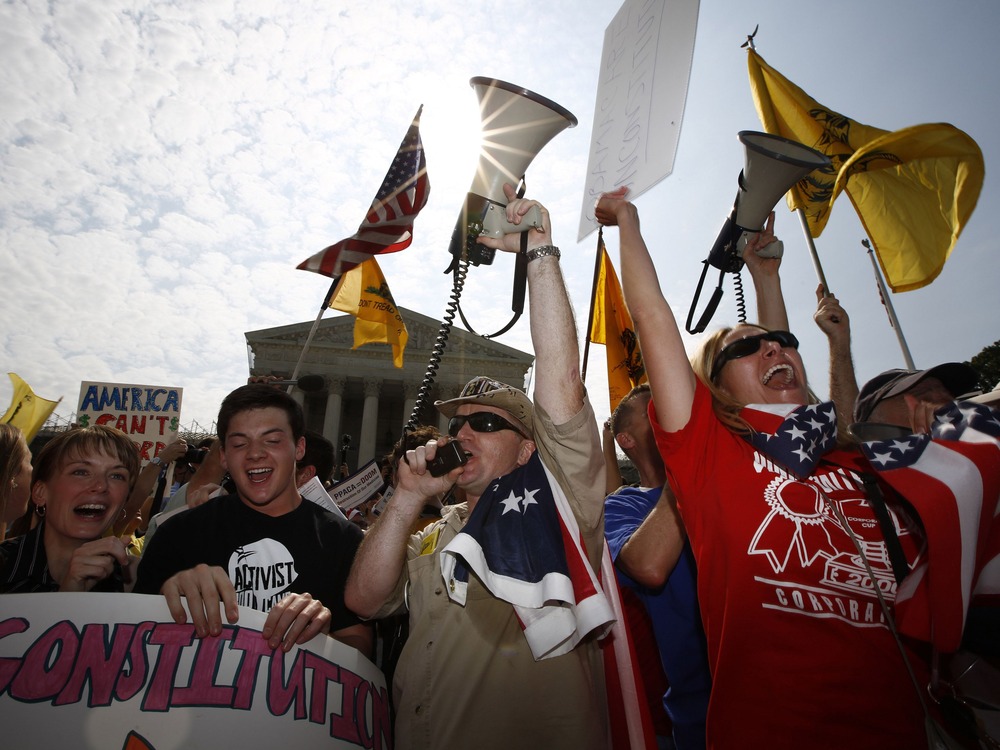 A sharply divided Supreme Court on Thursday upheld the centerpiece of Obama's signature healthcare overhaul law that requires that most Americans get insurance by 2014 or pay a financial penalty.