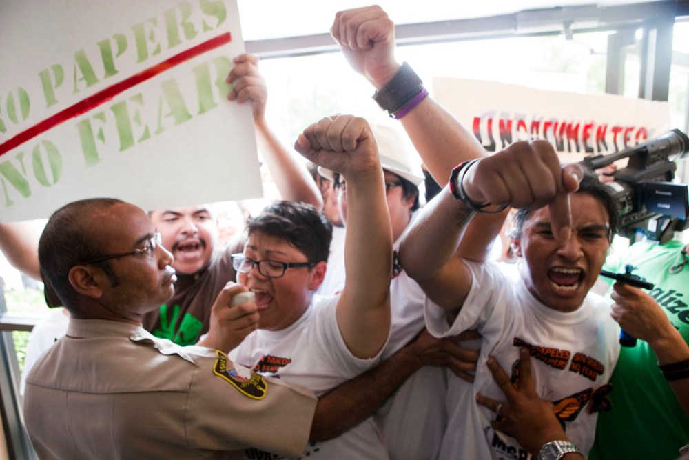 Isela Meraz and Fernando Lopez lead a group of undocumented Hispanics in protest against anti-immigration laws during a briefing on the civil rights effects of state immigration law held by the U.S. Commission on Civil Rights in Birmingham, Ala.