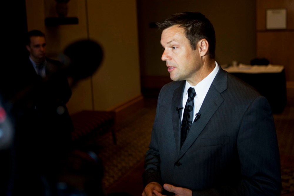 Kris Kobach fields questions from reporters in Birmingham, Ala. on Aug. 17, 2012. (Photo by Bob Miller for NBC News)