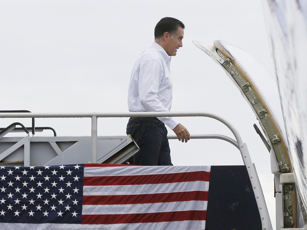 Republican presidential candidate and former Massachusetts Gov. Mitt Romney boards his campaign charter plane in West Palm Beach, Fla., Friday, Sept. 21, 2012.
