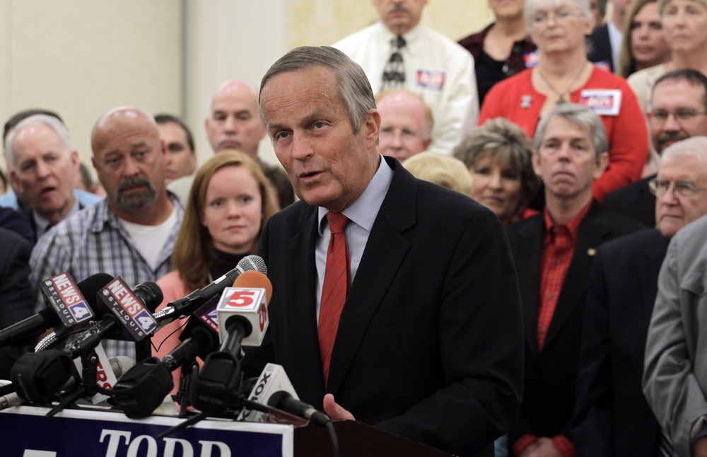 Missouri Republican Senate candidate, Rep. Todd Akin, R-Mo., speaks while surrounded by supporters during a news conference at the start of a statewide bus tour, Tuesday, September 25, 2012, in St. Louis.