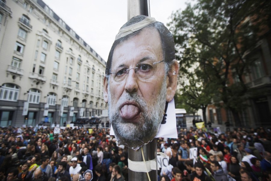 A picture of Spanish Prime Minister Mariano Rajoy is seen during the demonstration in Madrid.