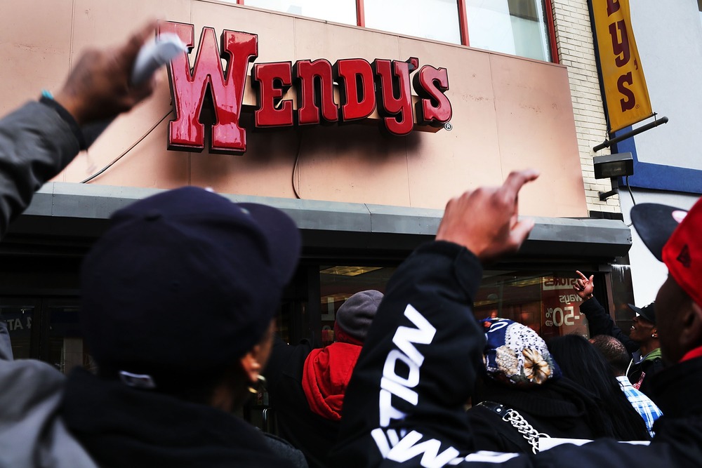 Protesters, many of them employees at Wendy's fast-food restaurant, demonstrate outside of one of the restaurants to demand higher pay and the right to form a union on November 29, 2012 in New York City.   (Photo by Spencer Platt/Getty Images)