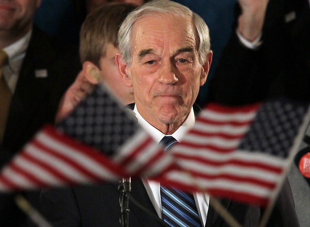 Republican presidential candidate, Texas Republican Rep. Ron Paul, peaks to supporters during a rally on the night of the Iowa caucus at the Courtyard Des Moines Ankeny on January 3, 2012 in Ankeny, Iowa.(Photo by Justin Sullivan/Getty Images)