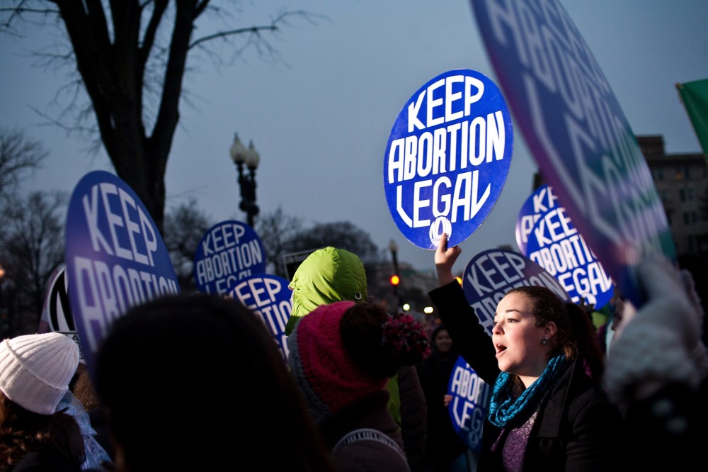 Pro-choice activists hold a vigil outside the U.S. Supreme Court on Jan. 23, 2012 in Washington, DC.