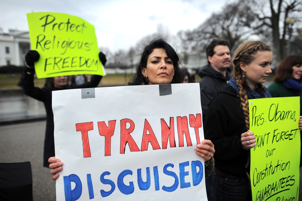 Christian religious activists display placards during a pro-life demonstration in front of the White House