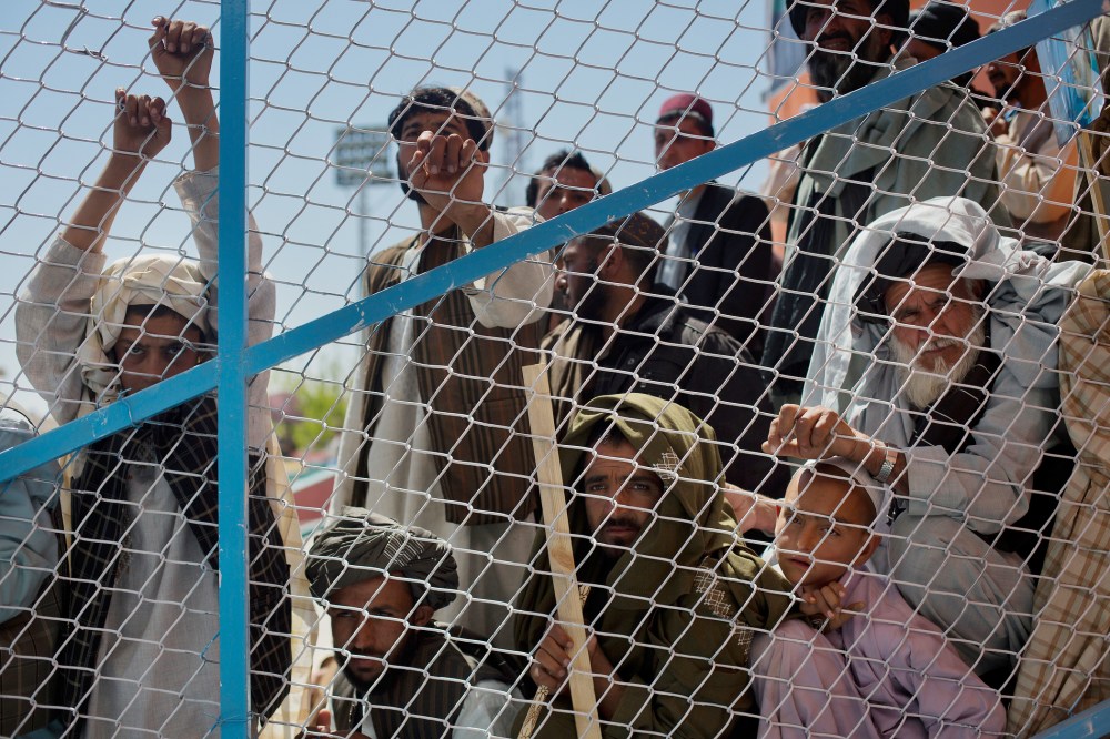 Supporters listen as Afghan presidential candidate Dr. Abdullah Abdullah to address a rally in Kandahar, Afghanistan, on March 30, 2014.