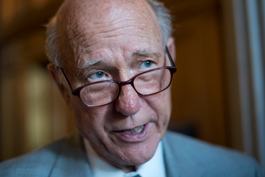 Sen. Pat Roberts, R-Kan., talks with reporters before a Senate luncheon at the Capitol in 2012.